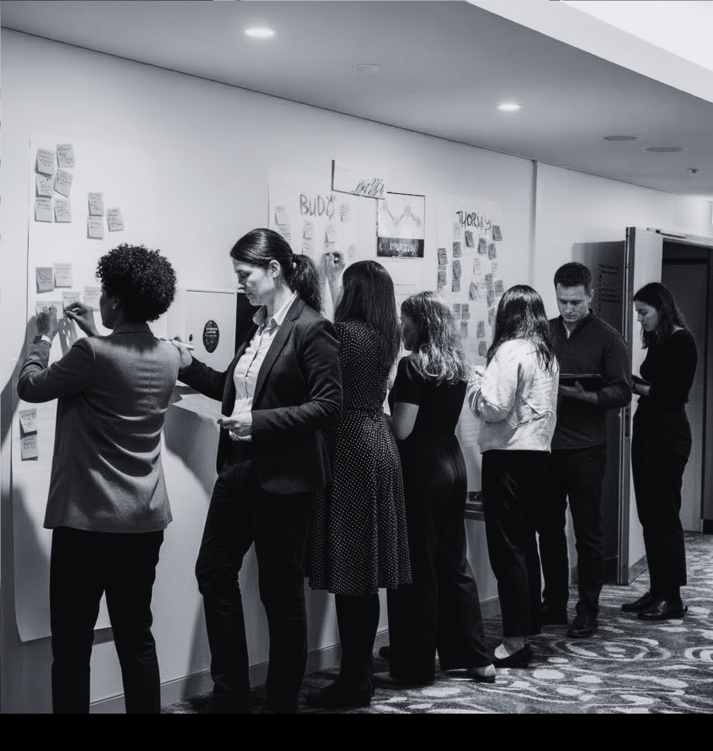 Participants collaborating around workshop material